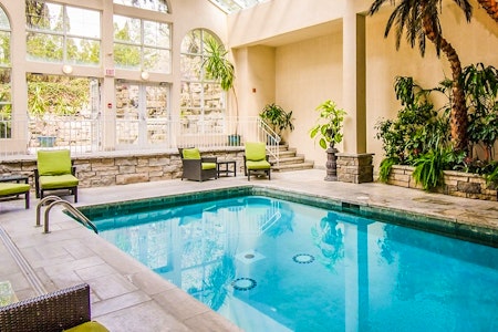 Sun-filled Pool Atrium at Queen’s Landing by Vintage Hotels, Ontario